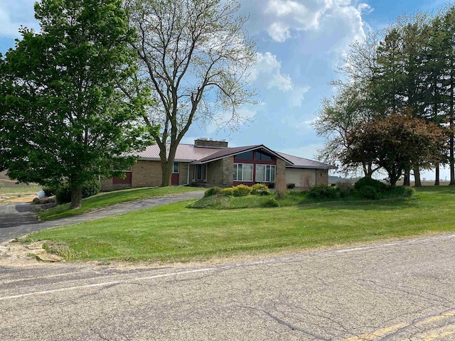 831 County Road Ig, Livingston, WI 53554 - mid-century home with a front lawn, metal roof, and stone siding