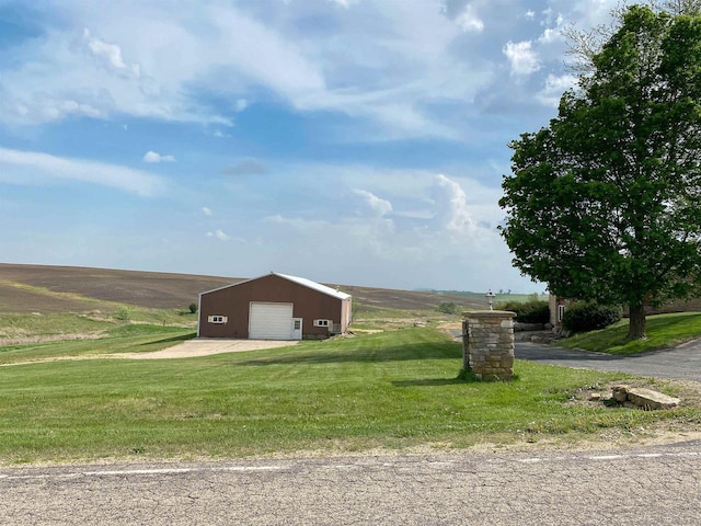 831 County Road Ig, Livingston, WI 53554 - view of home's exterior featuring a lawn, a garage, an outbuilding, a pole building, and driveway