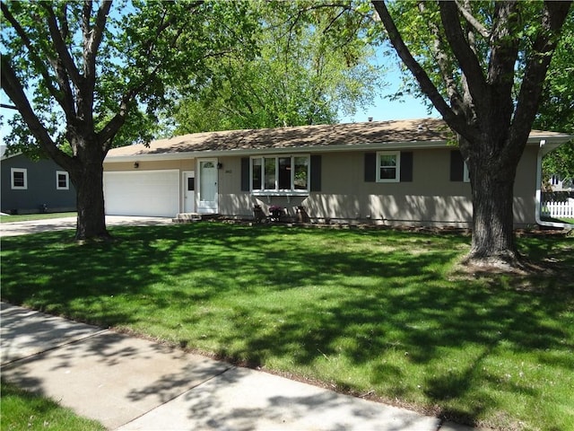 3412 Jill Ave, Eau Claire, WI 54701 - ranch-style house featuring an attached garage, a front lawn, and concrete driveway