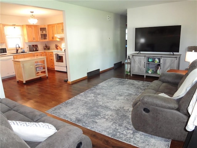 3412 Jill Ave, Eau Claire, WI 54701 - living room with dark wood-style floors and baseboards
