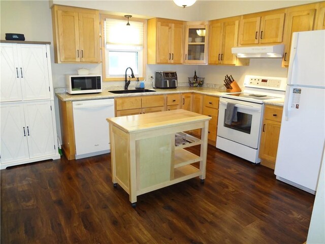 3412 Jill Ave, Eau Claire, WI 54701 - kitchen with white appliances, a sink, under cabinet range hood, light countertops, and dark wood-style floors
