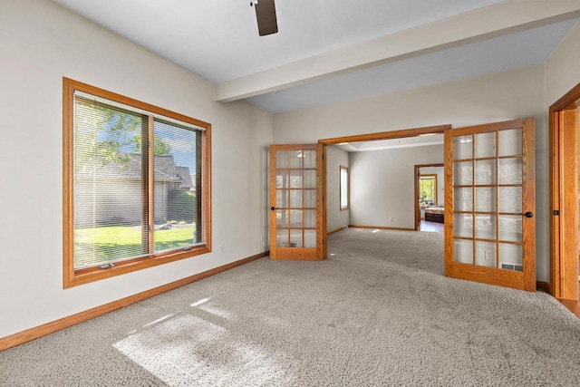 N8454 Muirfield Way, Menasha, WI 54952 - unfurnished room with french doors, carpet flooring, baseboards, ceiling fan, and beamed ceiling