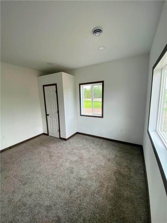 202 Huset Ln, Dallas, WI 54733 - carpeted empty room featuring baseboards