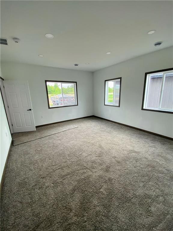 202 Huset Ln, Dallas, WI 54733 - carpeted spare room featuring baseboards and recessed lighting