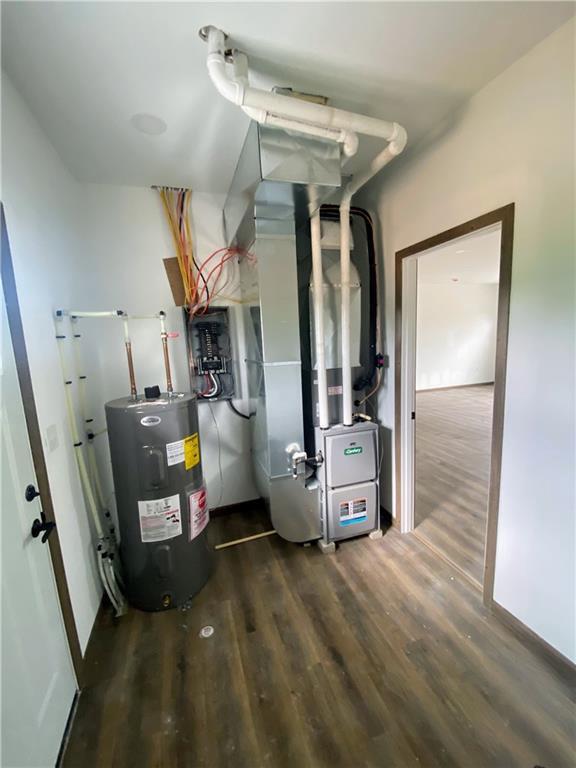 202 Huset Ln, Dallas, WI 54733 - utility room featuring water heater and heating unit