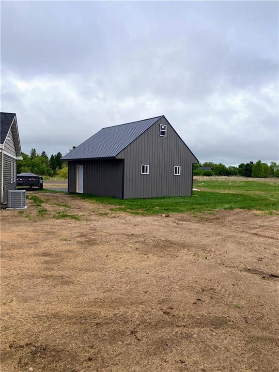 202 Huset Ln, Dallas, WI 54733 - view of pole building with cooling unit