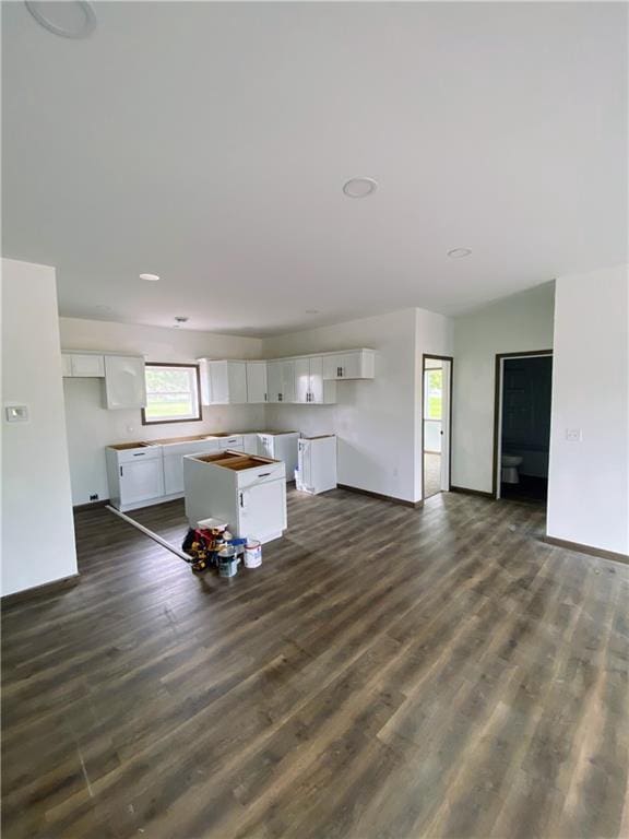 202 Huset Ln, Dallas, WI 54733 - kitchen featuring white cabinets, baseboards, and dark wood-style floors