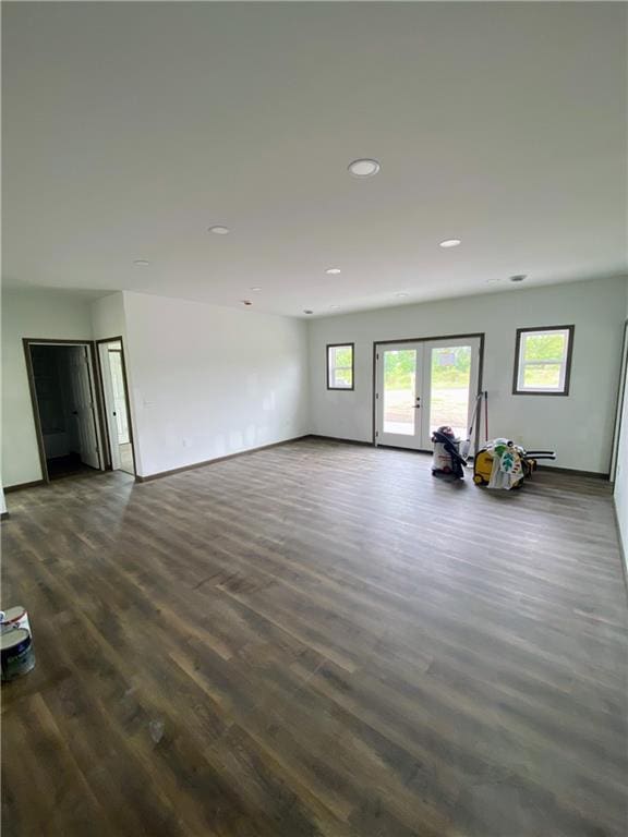 202 Huset Ln, Dallas, WI 54733 - unfurnished living room with dark wood-style floors, healthy amount of natural light, french doors, recessed lighting, and baseboards