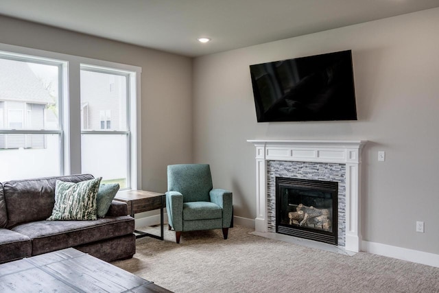 241 E Hubert St, Edgerton, WI 53534 - carpeted living room with a fireplace, baseboards, and recessed lighting