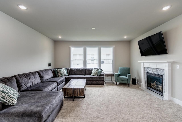 241 E Hubert St, Edgerton, WI 53534 - living room with recessed lighting, light carpet, a fireplace with flush hearth, and baseboards