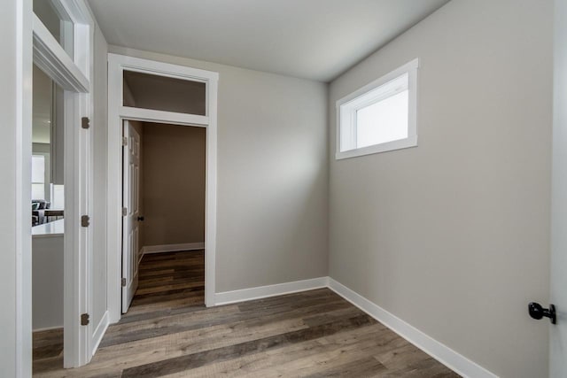 241 E Hubert St, Edgerton, WI 53534 - unfurnished bedroom with wood finished floors and baseboards