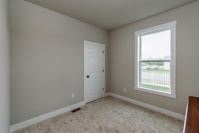 241 E Hubert St, Edgerton, WI 53534 - carpeted spare room with baseboards
