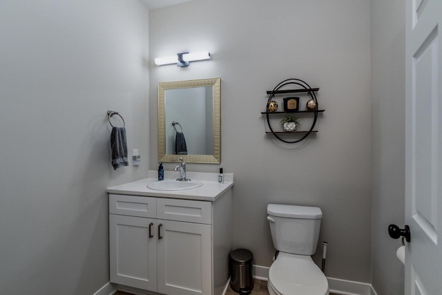 241 E Hubert St, Edgerton, WI 53534 - bathroom with vanity, toilet, and baseboards