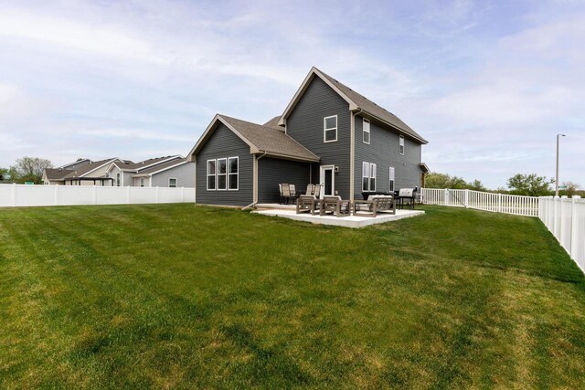 241 E Hubert St, Edgerton, WI 53534 - rear view of property featuring a patio