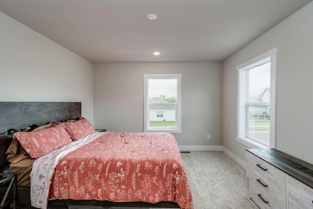 241 E Hubert St, Edgerton, WI 53534 - bedroom featuring light colored carpet, baseboards, and recessed lighting
