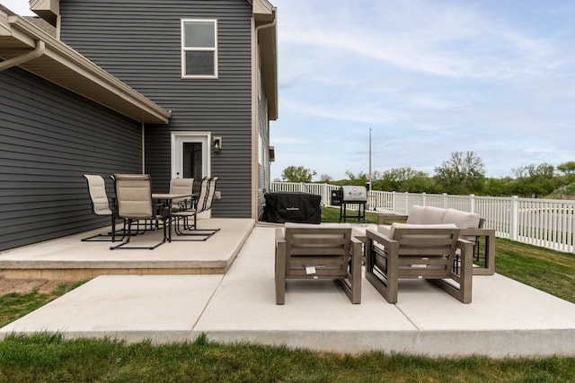 241 E Hubert St, Edgerton, WI 53534 - view of patio / terrace with fence, an outdoor hangout area, and outdoor dining space