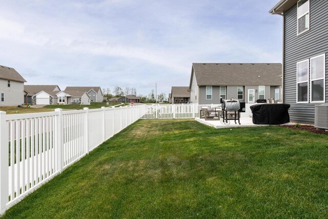 241 E Hubert St, Edgerton, WI 53534 - view of yard with a residential view, a patio, and cooling unit