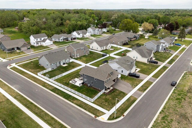 241 E Hubert St, Edgerton, WI 53534 - aerial view of residential area with a heavily wooded area