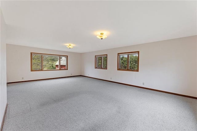 N7681 Jagielo Rd, Pittsville, WI 54466 - empty room featuring plenty of natural light, baseboards, and carpet flooring