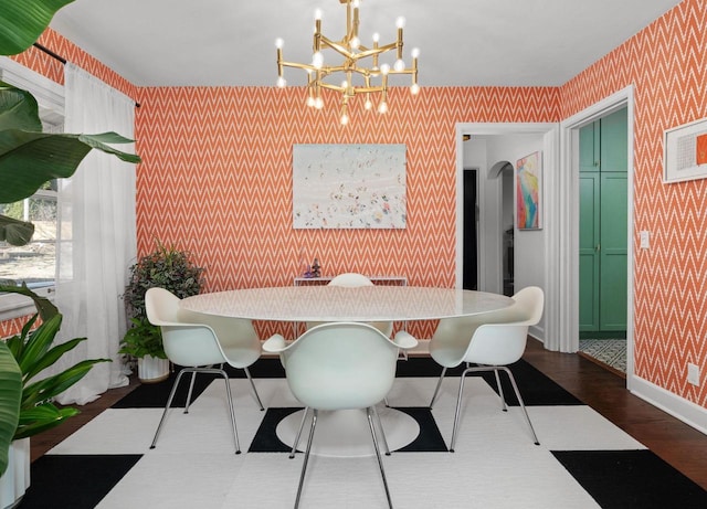 4106 Meyer Ave, Madison, WI 53711 - dining space featuring wallpapered walls, a chandelier, wood finished floors, and baseboards