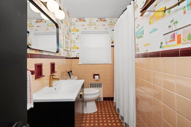4106 Meyer Ave, Madison, WI 53711 - bathroom with radiator heating unit, wallpapered walls, toilet, a wainscoted wall, and vanity