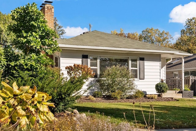 4106 Meyer Ave, Madison, WI 53711 - view of home's exterior featuring a chimney and roof with shingles