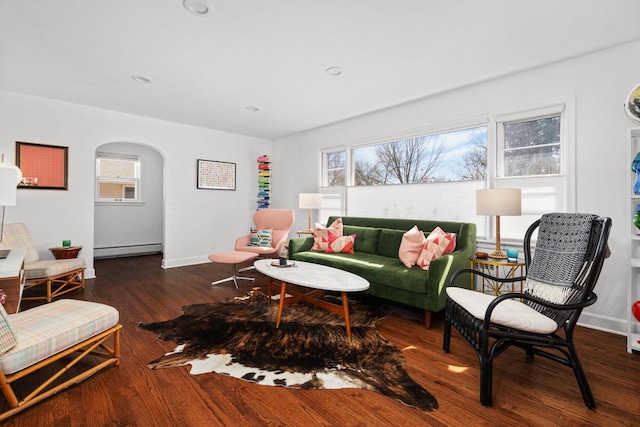 4106 Meyer Ave, Madison, WI 53711 - living area featuring a baseboard radiator, wood finished floors, arched walkways, baseboards, and recessed lighting