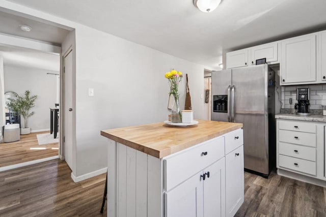 1578 Cass St, Green Bay, WI 54302 - kitchen featuring stainless steel fridge, dark wood finished floors, a kitchen island, white cabinetry, and wooden counters