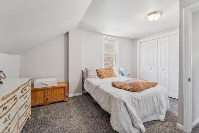 1578 Cass St, Green Bay, WI 54302 - bedroom featuring dark colored carpet, a closet, baseboards, and lofted ceiling