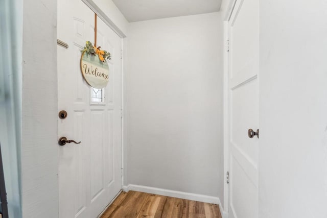 1578 Cass St, Green Bay, WI 54302 - doorway to outside featuring wood finished floors and baseboards