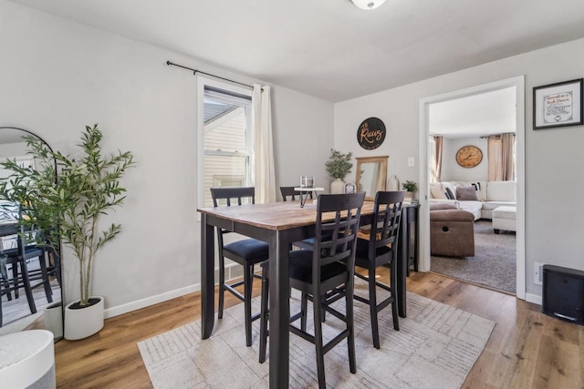 1578 Cass St, Green Bay, WI 54302 - dining room featuring light wood-type flooring and baseboards