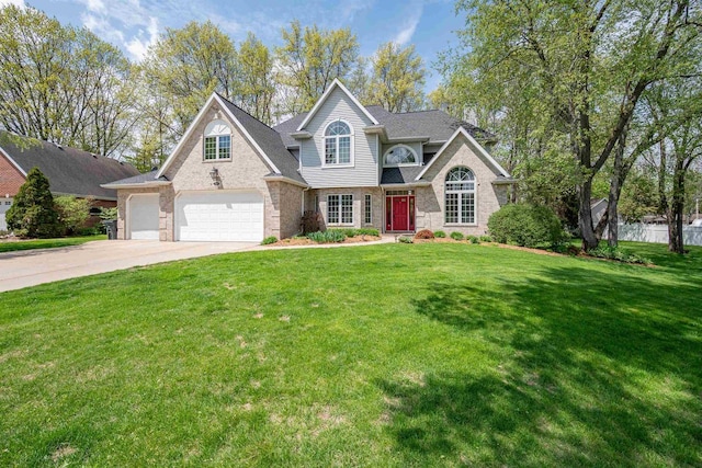 1516 Bradbury Ct, Green Bay, WI 54313 - traditional home featuring concrete driveway, a front lawn, and stone siding