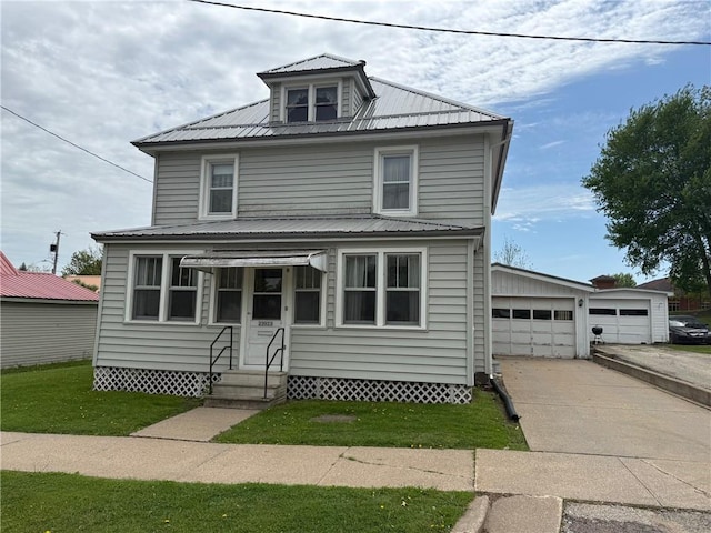 23923 Washington St, Independence, WI 54747 - american foursquare style home featuring entry steps, metal roof, a garage, and a front lawn