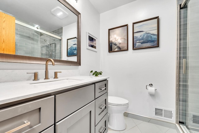 4619 Stonebridge Dr, Racine, WI 53404 - bathroom with tile patterned floors, a stall shower, toilet, and vanity
