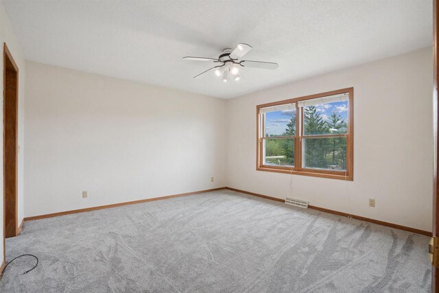 119 White St, Benton, WI 53803 - carpeted empty room with ceiling fan and baseboards