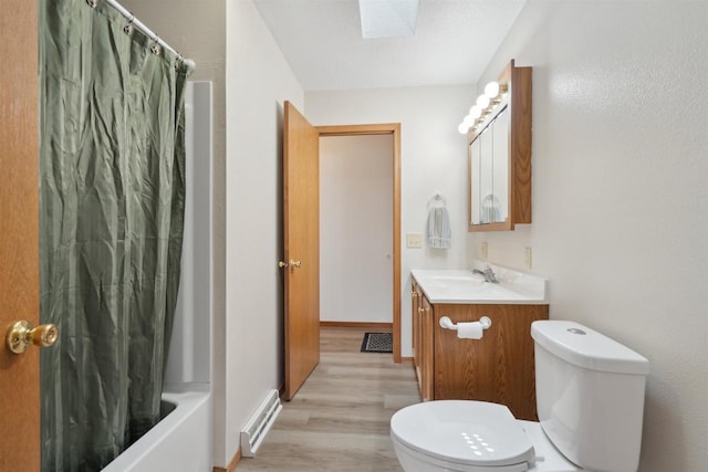 119 White St, Benton, WI 53803 - full bathroom featuring toilet, wood finished floors, vanity, and a skylight