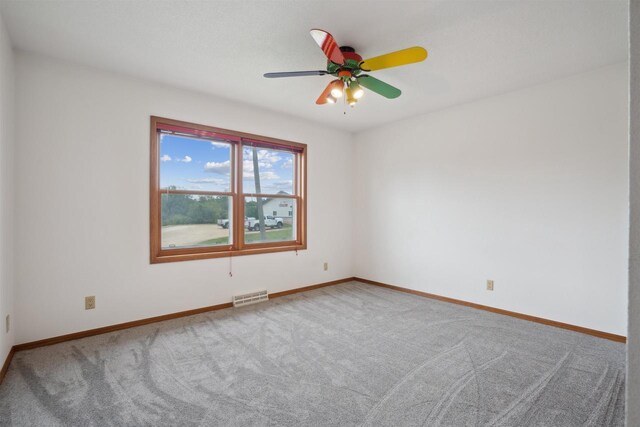 119 White St, Benton, WI 53803 - empty room with carpet flooring, ceiling fan, and baseboards