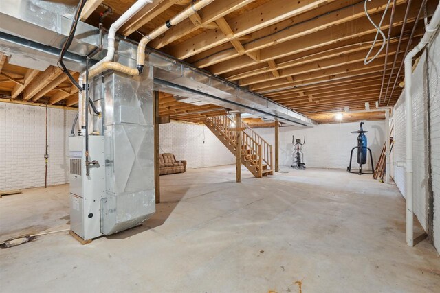 119 White St, Benton, WI 53803 - unfinished basement featuring stairway and heating unit