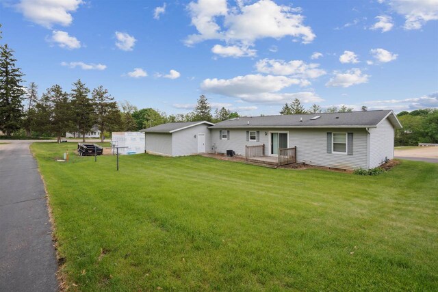 119 White St, Benton, WI 53803 - view of front facade featuring a front yard and a wooden deck