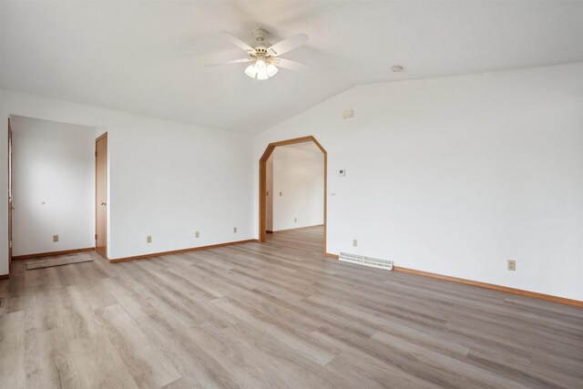 119 White St, Benton, WI 53803 - unfurnished room with a ceiling fan, light wood-type flooring, vaulted ceiling, and baseboards