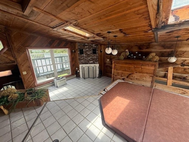 228227 County Road Y, Birnamwood, WI 54414 - unfurnished bedroom featuring wood ceiling, tile patterned floors, and wooden walls