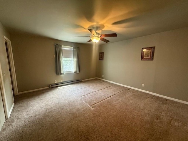 228227 County Road Y, Birnamwood, WI 54414 - unfurnished room featuring a baseboard heating unit, carpet flooring, ceiling fan, and baseboards