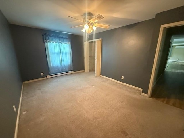 228227 County Road Y, Birnamwood, WI 54414 - carpeted spare room with a baseboard heating unit, a ceiling fan, and baseboards
