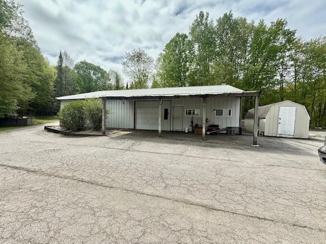 228227 County Road Y, Birnamwood, WI 54414 - garage featuring a storage unit