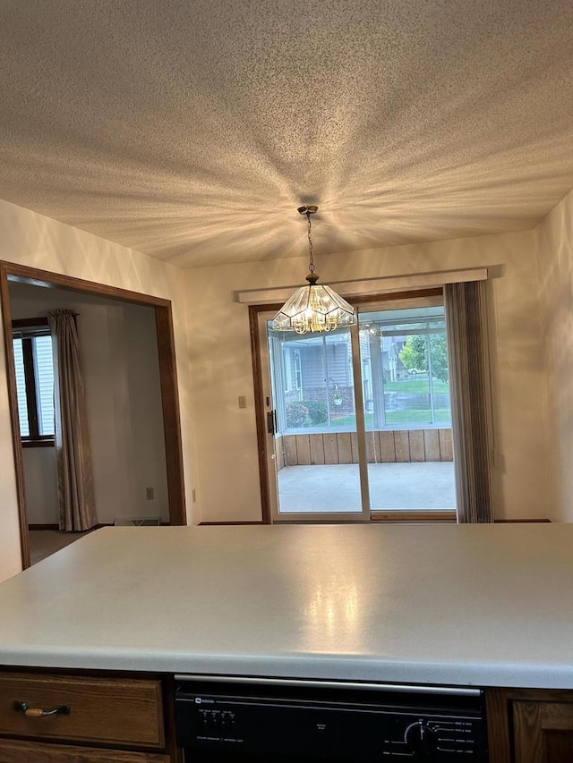 1010 Whispering Winds Pl, Onalaska, WI 54650 - kitchen featuring healthy amount of natural light, dishwasher, light countertops, and hanging light fixtures