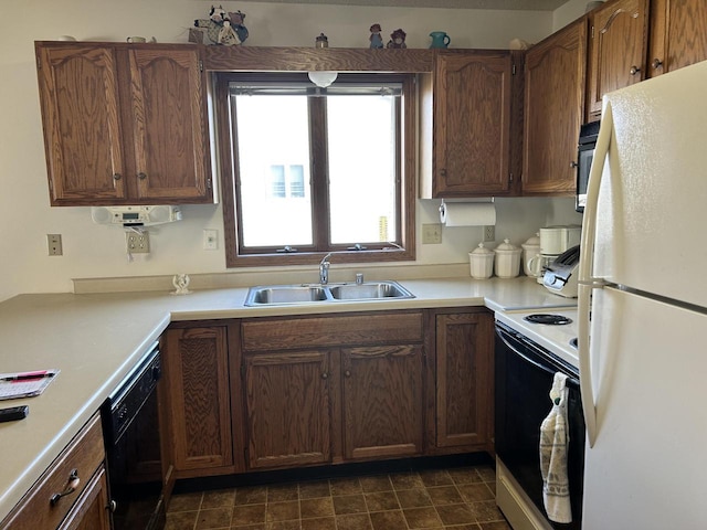 1010 Whispering Winds Pl, Onalaska, WI 54650 - kitchen featuring freestanding refrigerator, electric stove, dishwasher, a sink, and light countertops