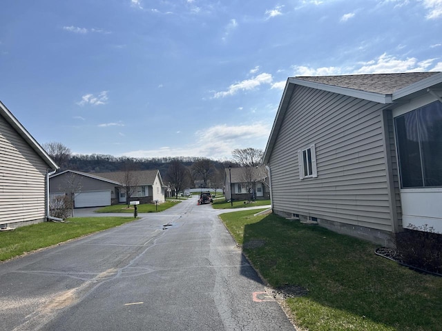 1010 Whispering Winds Pl, Onalaska, WI 54650 - view of asphalt street with a residential view