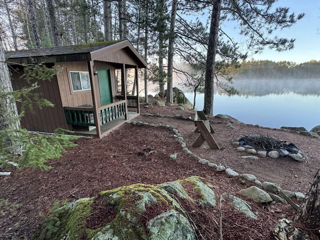 1948 Wild Life Ln, Eagle River, WI 54521 - view of yard featuring an outbuilding and a water view