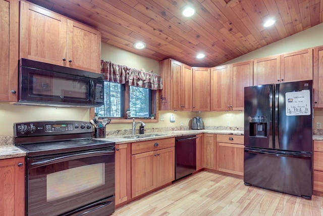 1948 Wild Life Ln, Eagle River, WI 54521 - kitchen featuring black appliances, a sink, light wood-style flooring, recessed lighting, and vaulted ceiling