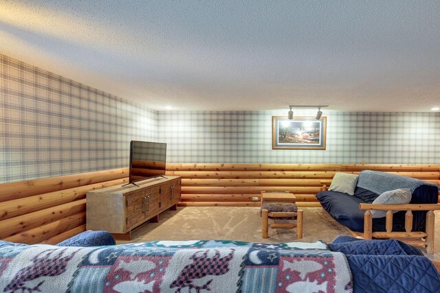 1948 Wild Life Ln, Eagle River, WI 54521 - living room featuring wallpapered walls, log walls, a textured ceiling, and carpet flooring